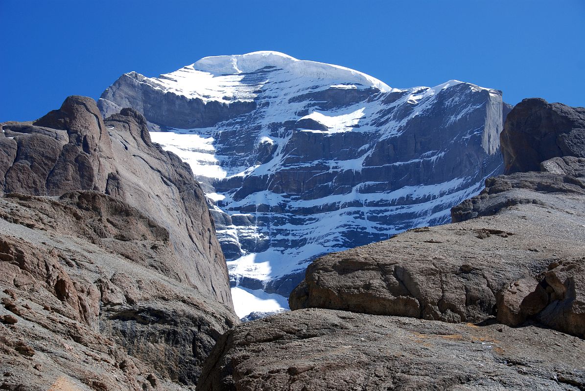 23 Mount Kailash West Face From Just Before Tamdrin On Mount Kailash Outer Kora The west face of Mount Kailash became visible between the rock ridges of the Lha Chu Valley just before Tamdrin.